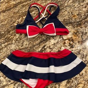 Red, white and blue swimsuits.